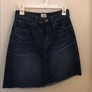 Denim skirt with raw hem.